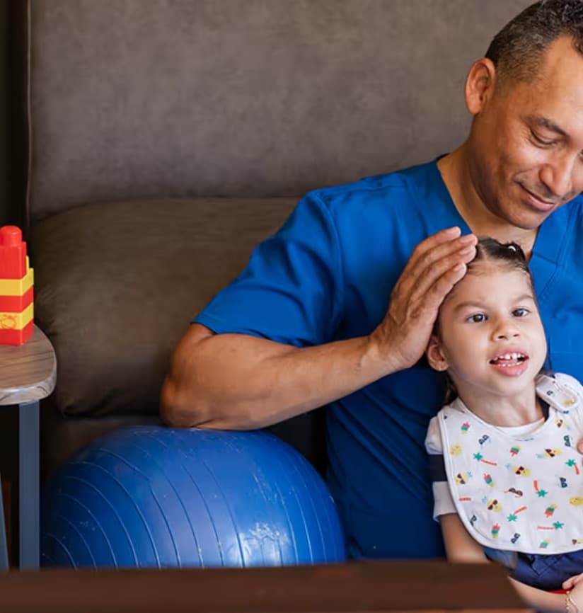 An in-home physical therapy session with an exercise ball